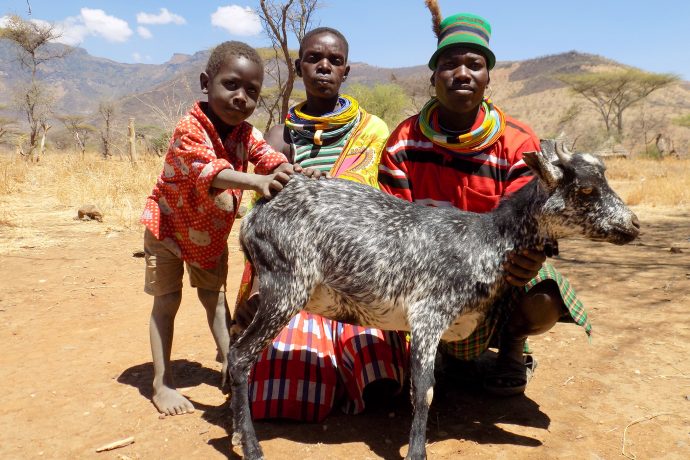 Livestock owner and her family show off their “Milk Queen” goat. / ACDI/VOCA. Source: https://blog.usaid.gov/2017/05/raising-goats-and-confidence-in-uganda/