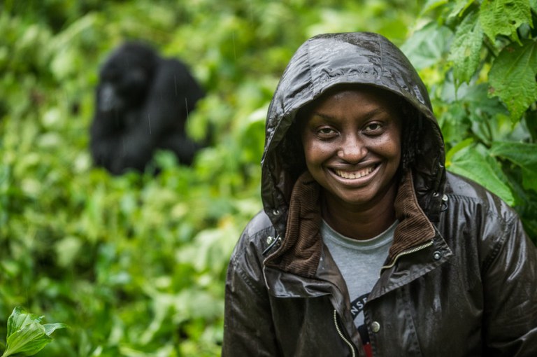 Dr. Gladys Kalema-Zikusoka poses with a mountain gorilla