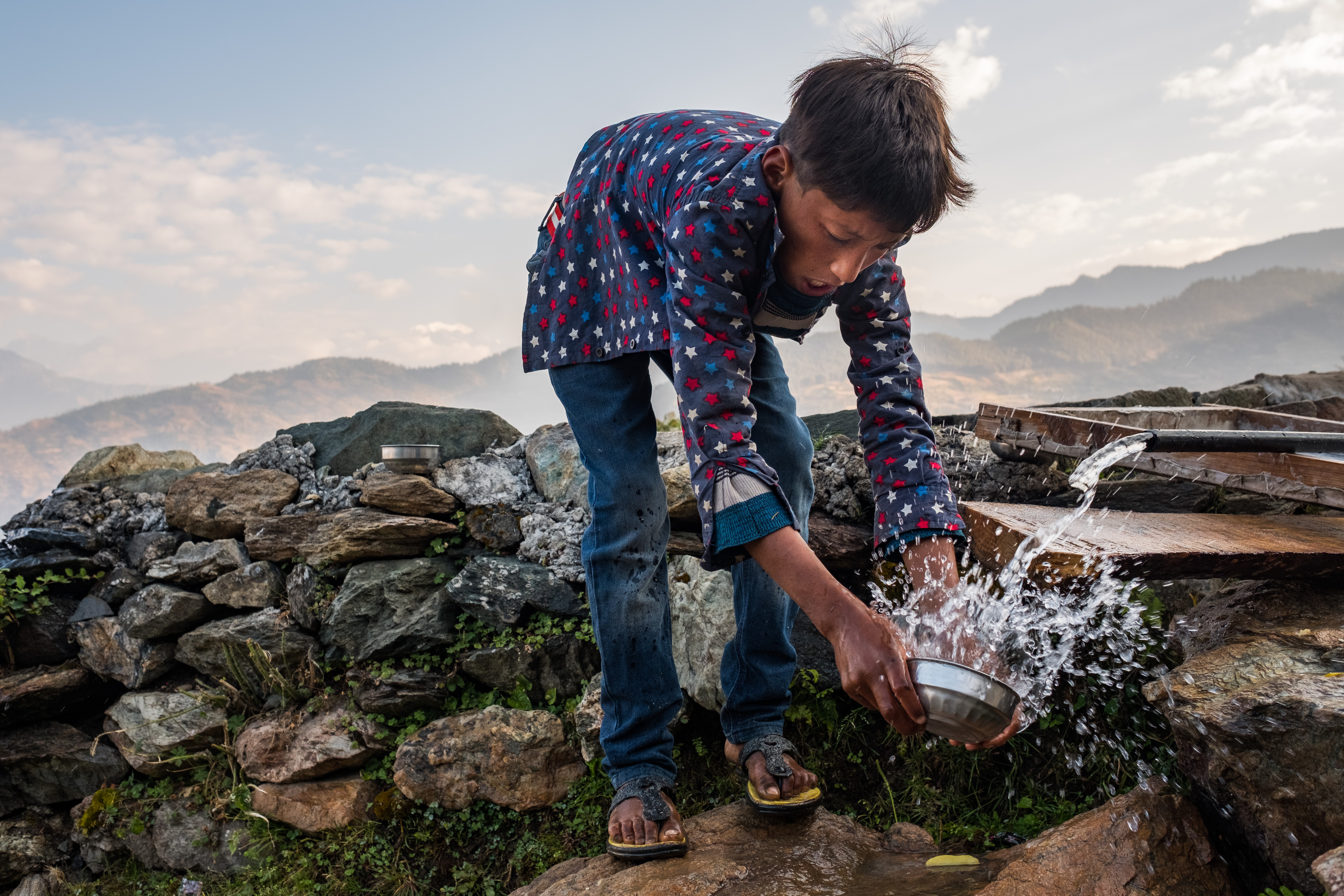 Man accesses water in Kailas, Bajhang District, Nepal