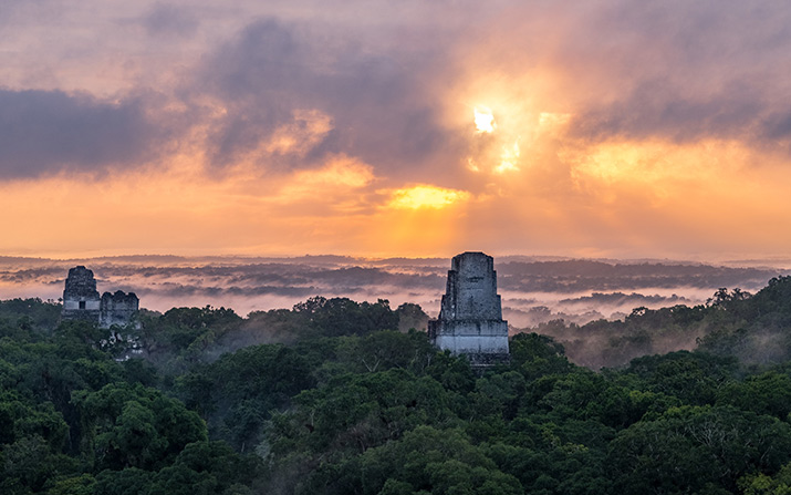 December 2017. Temples in Tikal National Park at sunrise. Tikal, Guatemala. Photograph by Jason Houston for USAID