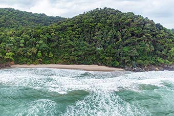 Ocean waves and sandy beach at Jeanette Kawas National Park