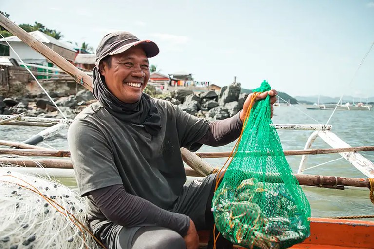 A crab fisher shows off his catch.