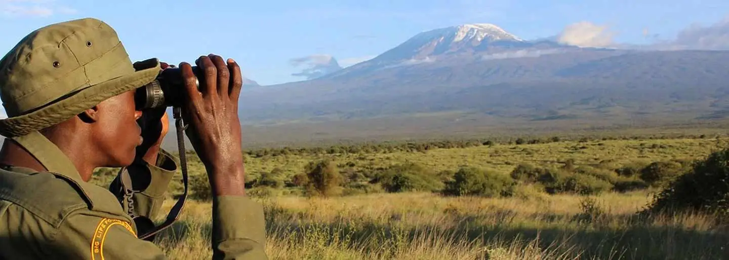 A community scout surveys the landscape from Kittenden Outpost, Kenya.  Photo: Matthew Erdman.