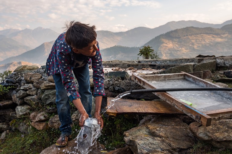 Man accesses water in Kailas, Bajhang District, Nepal_credit Jason Houston for USAID